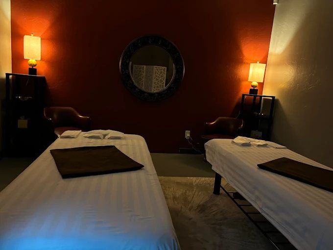 The Desert Zen couples suite with two massage tables side by side under warm lamplight